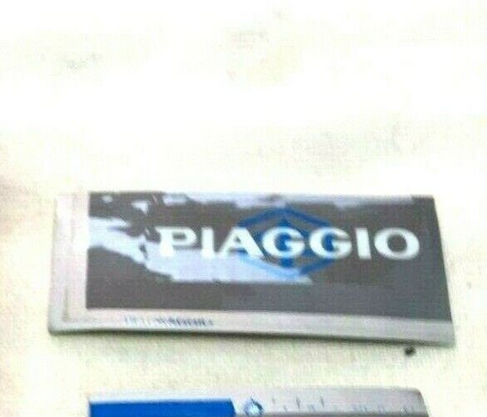 487446   TARGHETTA  ADESIVA  ORIGINALE PIAGGIO LIBERTY 125 98-00  *