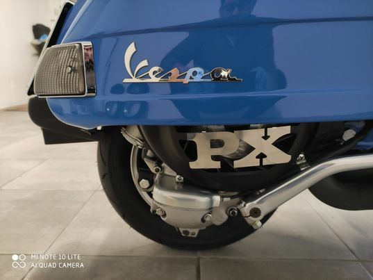 COPRIVENTOLA VESPA PX 125 150 200 NERO CON SCRITTA IN ACCIAIO  + OMAGGIO